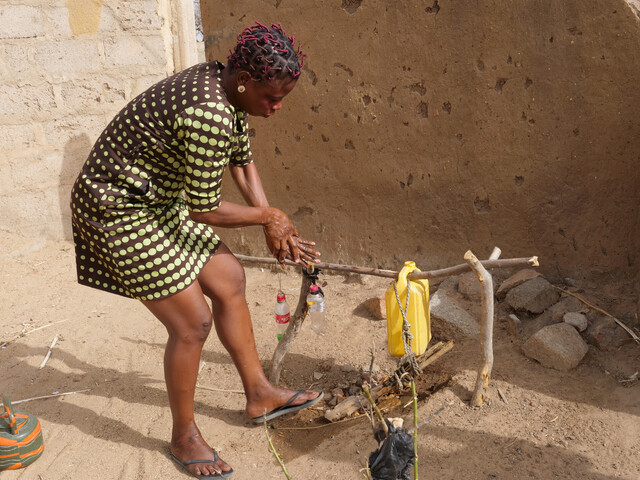 Using a simple handwashing device in Bongo, Ghana