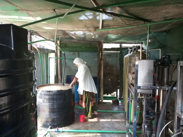 Shiuli Begum from Patharghata in her water treatment plant