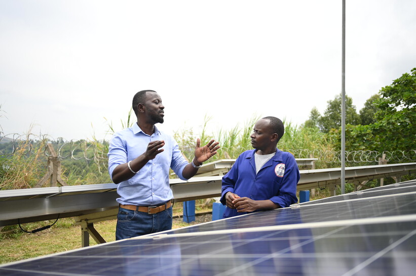 Philip Oyamo discussing with Bosco Mwije, a plumber withUganda’s Mid-Western Umbrella for Water and Sanitation Authority in Rweihamba, Kasenda Philip Oyamo discussing with Bosco Mwije, a plumber withUganda’s Mid-Western Umbrella for Water and Sanitation Authority in Rweihamba, Kasenda