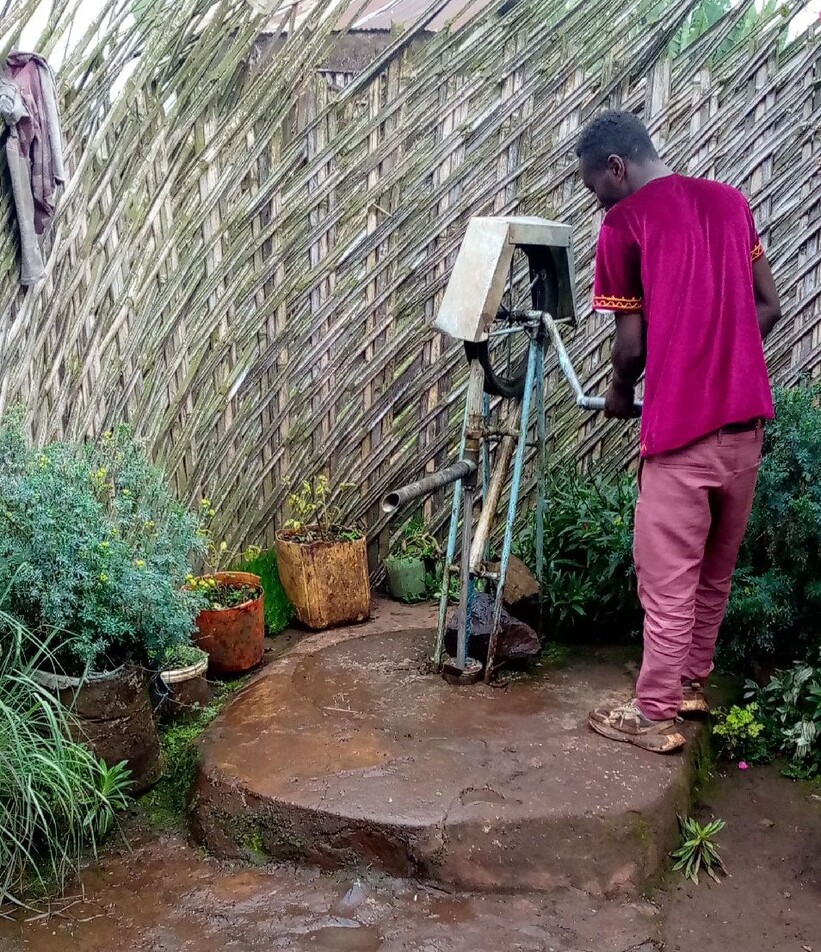 A data collector checking the status of a water point
