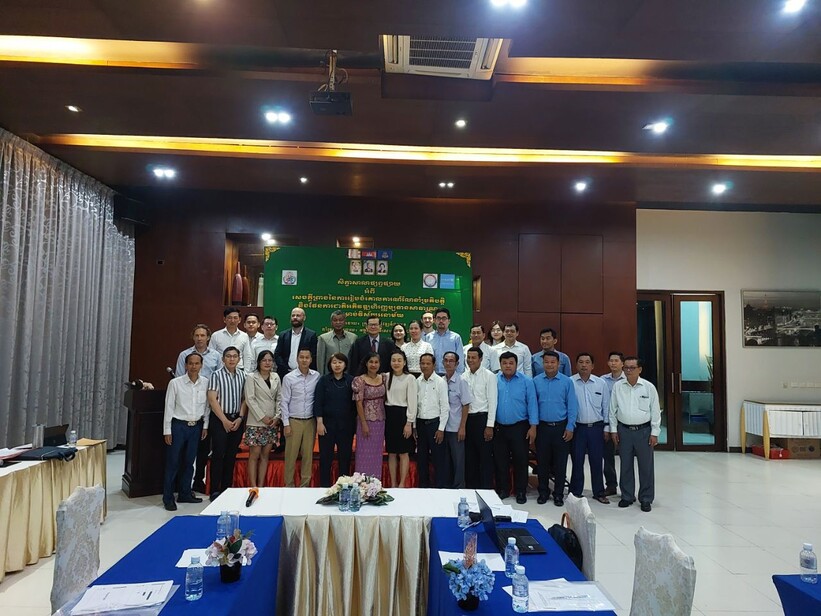 Participants stand together for a photo at the final workshop