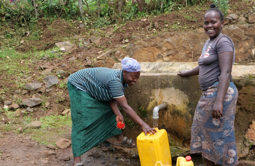 Women at a water tap in South Ari, Ethiopia