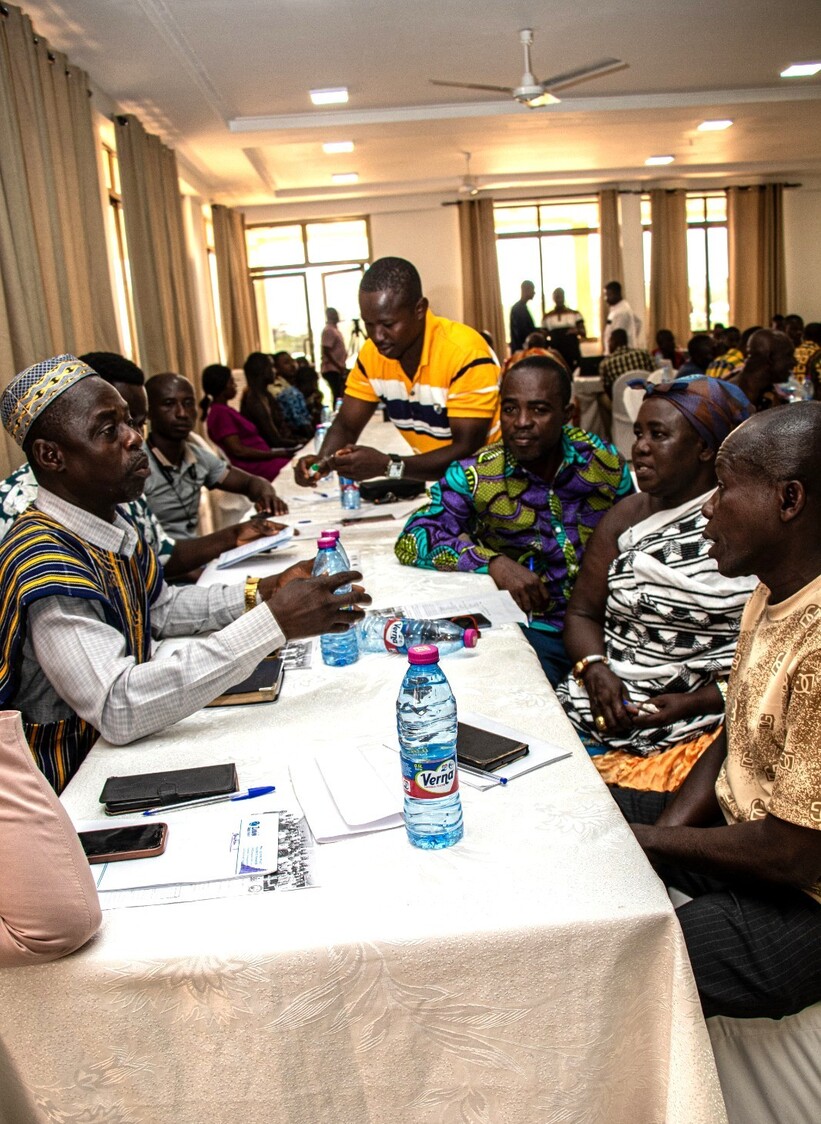 Stakeholders work in small groups to review the framework 