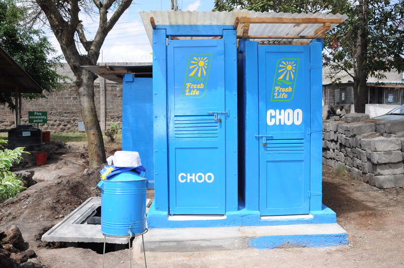 A container based toilet where sanitation waste is safely held in shallow containers (photo by: The Sanergy Collaborative)
