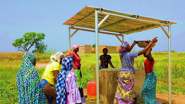 Women of Sigriyaoghin fetching water from their new improved water point (IRC, 2023)