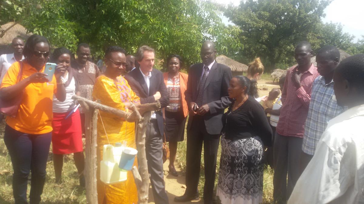 The GSF delegation inspects a tippy tap at one of the homes in Aton ODF Village