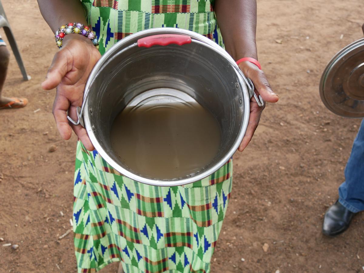 Showing a bucket of dirty water