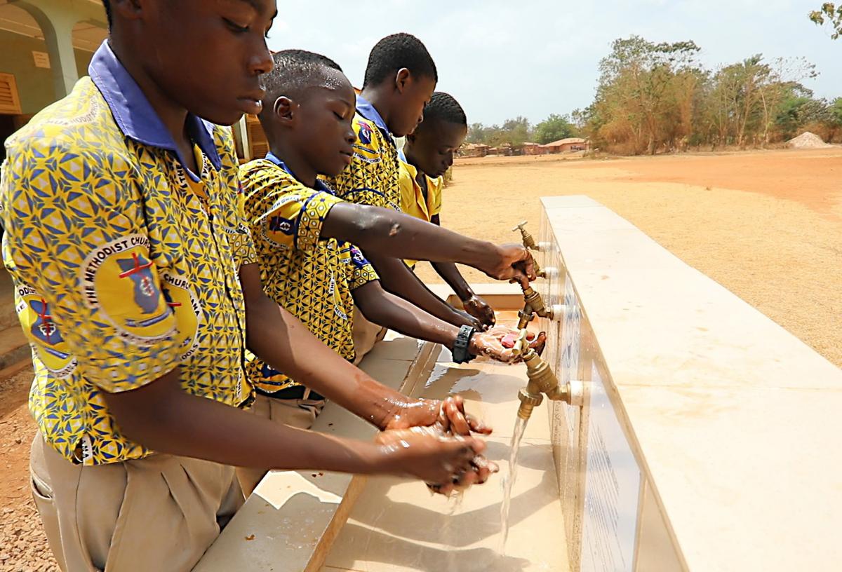 Boys from the Methodist Basic School washing hands at the new facility