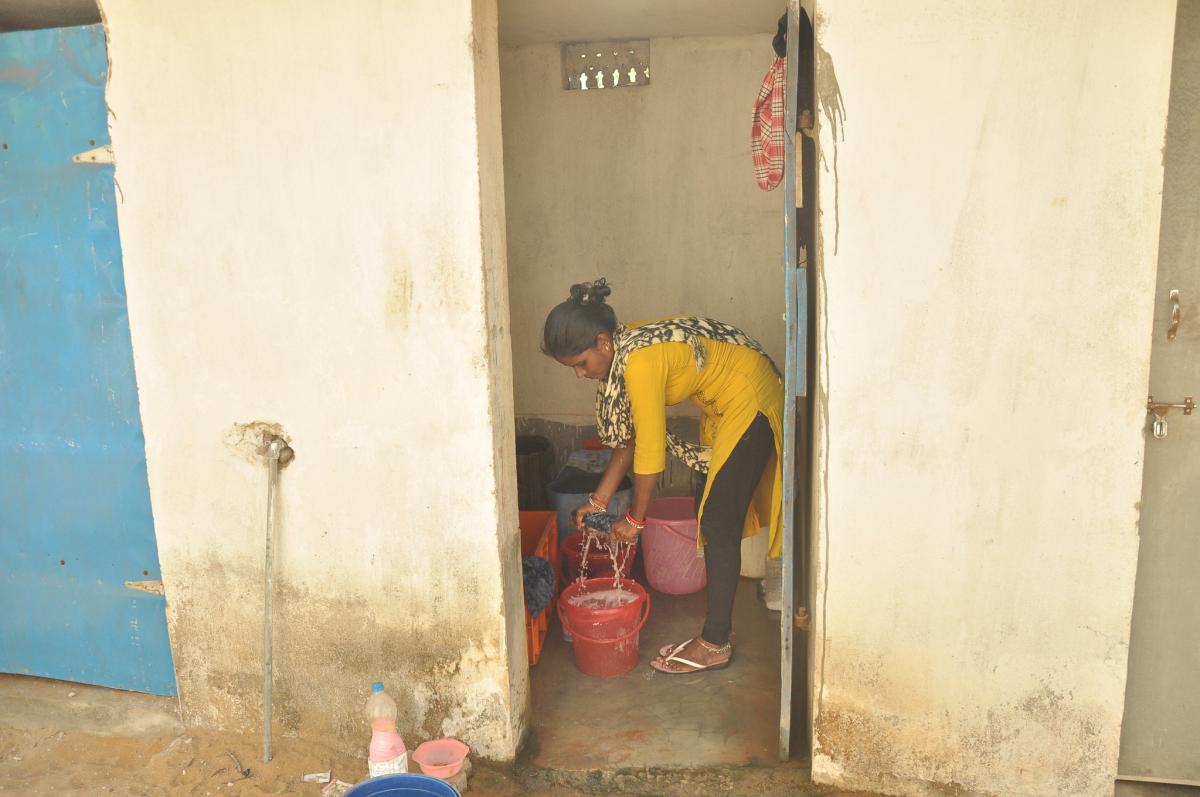 Woman in Odisha washing clothes Woman in Odisha washing clothes