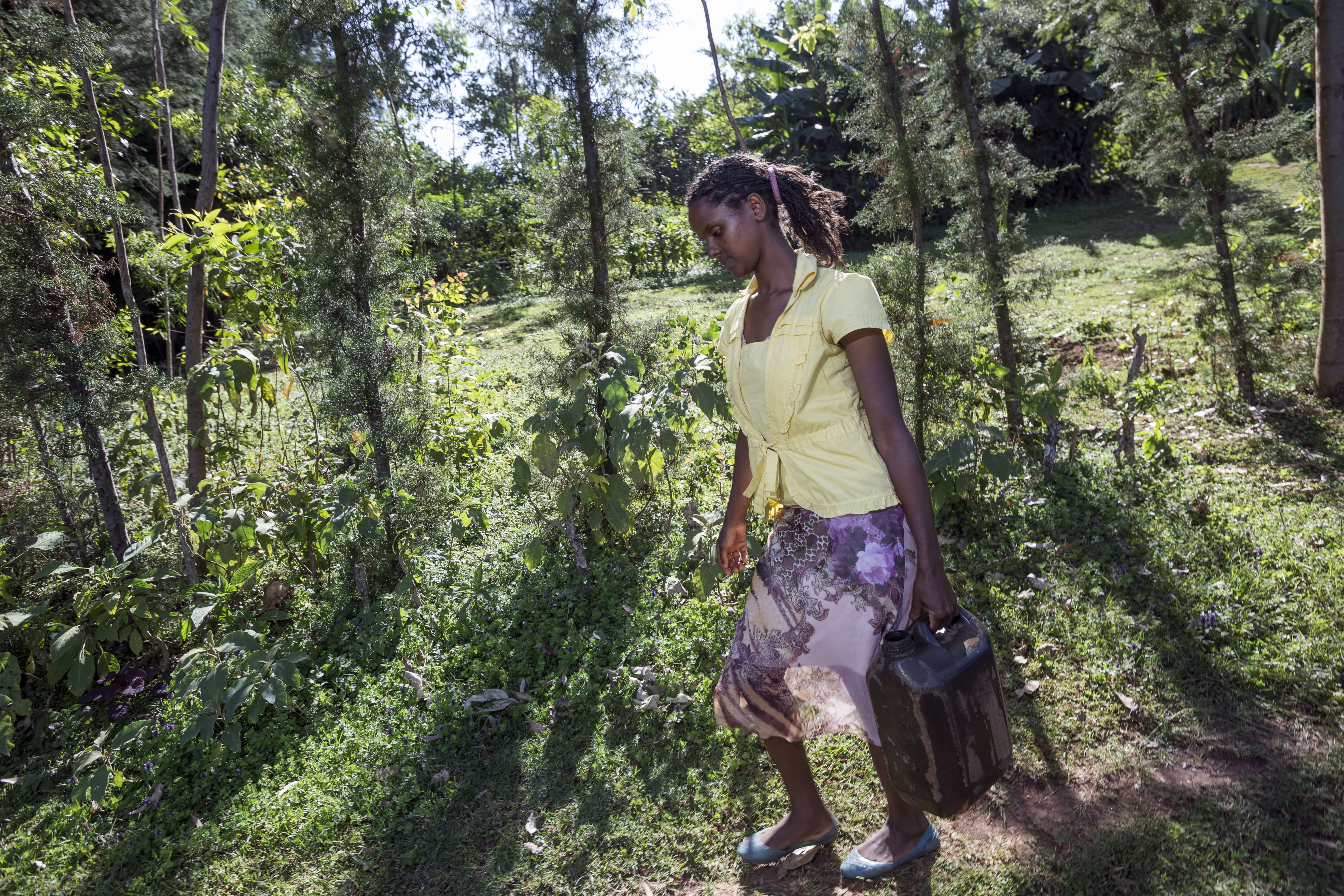 Medannet collecting water for her family