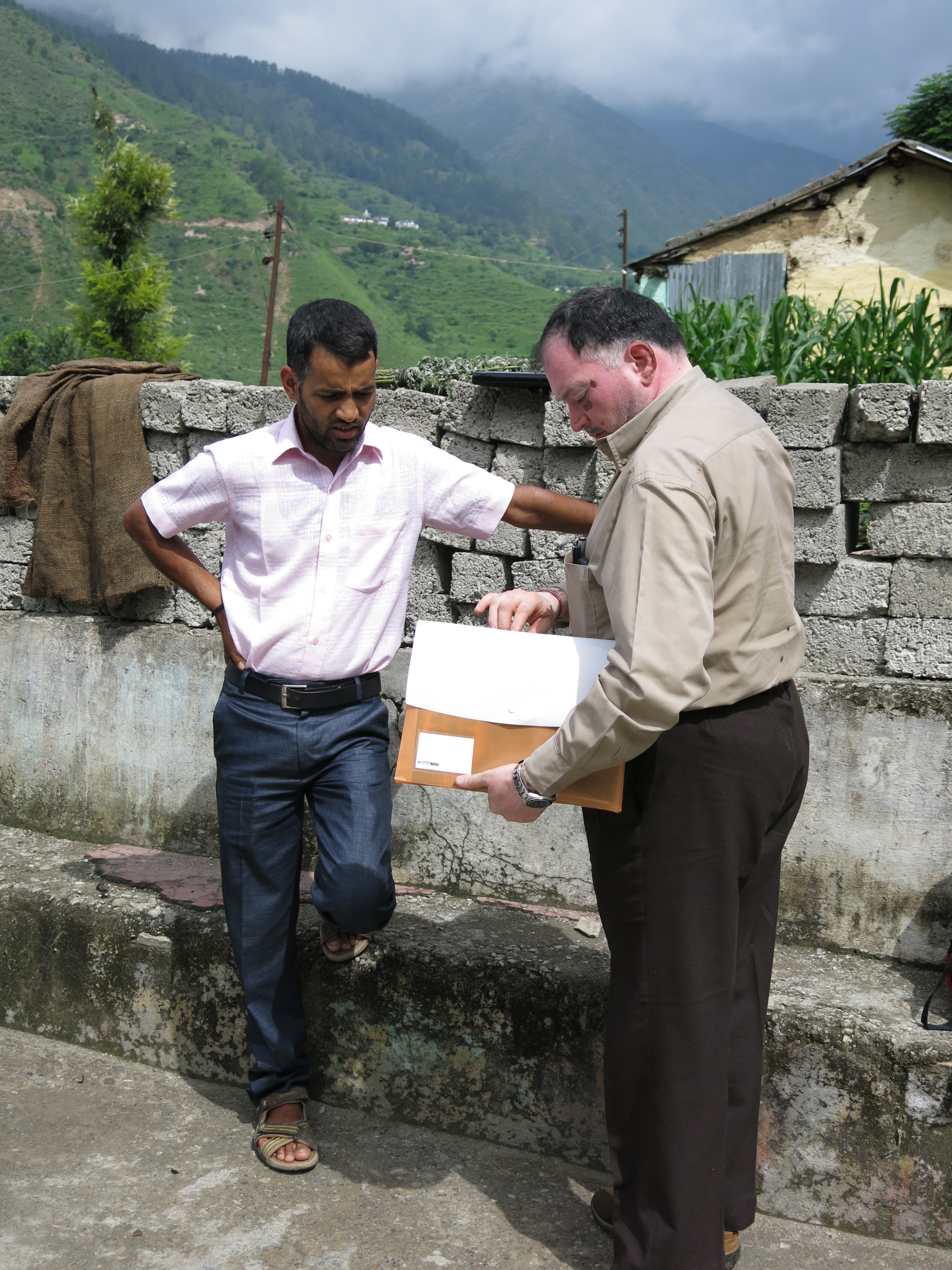 Shri Jai Prakash, Pradhan of Buyasari Gram Panchayat and Mr. Saxena, project coordinator at HIHT review the mechanism to apply for a water supply system