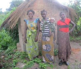 Beatrice in red top with two other committee members (© Plan Zambia)