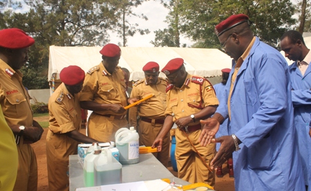 The Commissioner General and senior Officers inspecting soap produced during a training of trainers programme in cottage–scale soap making in 2012. Photo: Uganda Prisons Service Commissioner General and other senior Officers inspecting the soap produced