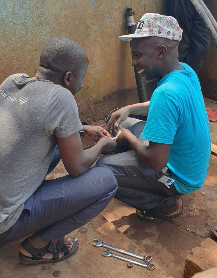 Fabien (right) getting to grips with the Vergnet pump. Credit: Patrick Moriarty/IRC Fabien (right) getting to grips with the Vergnet pump. Credit: Patrick Moriarty/IRC