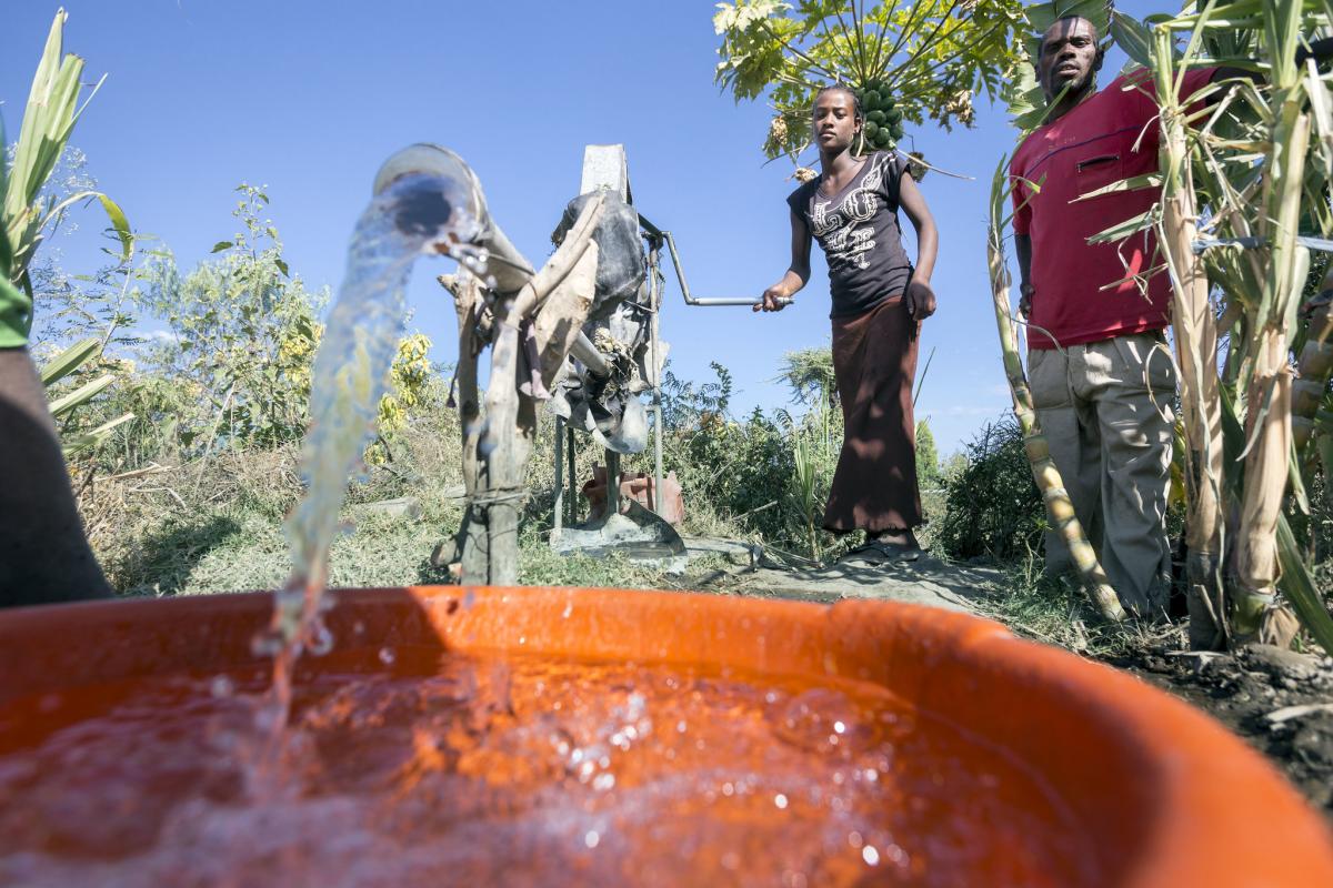 Pumping water using a family rope pump, Ethiopia