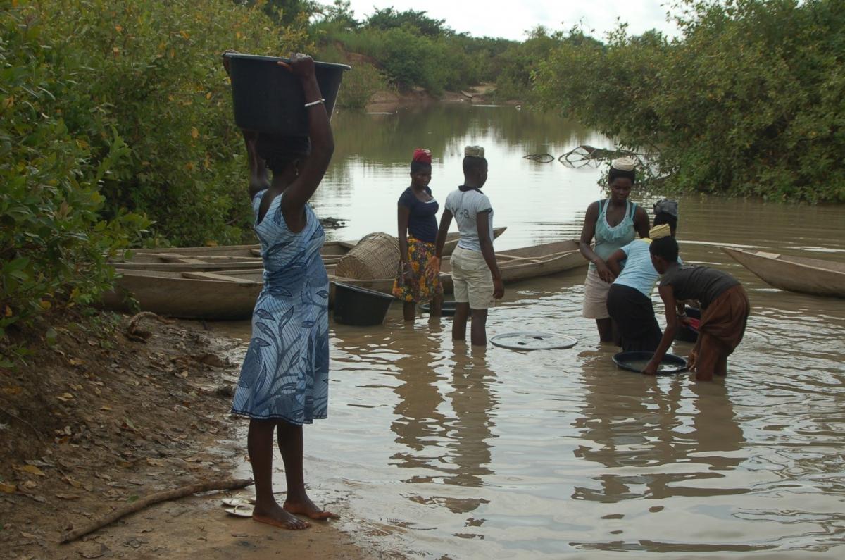 Water collection from a natural stream in Northern Ghana. Often the water is stored at household level in these same collection buckets (Photo by Michael Robeson) Water collection from a natural stream in Northern Ghana. Often the water is stored at household level in these same collection buckets (Photo by Michael Robeson)
