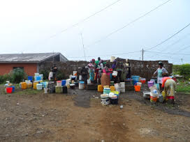 Community water point in Cameroon Photo: by Angela Hutson The water point be classified as functional, but water availability is low. Due to water scheduling and the high elevation of this standtap relative to the pipe network. Photo by Angela Huston in Buea Cameroon.