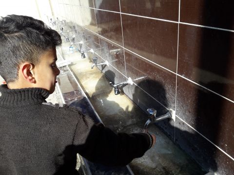 Photo: World Vision Boy washing hands at wash basin