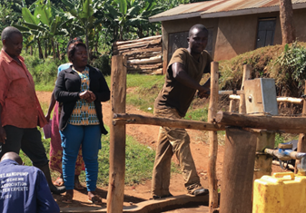 At the water pump in Kabarole District