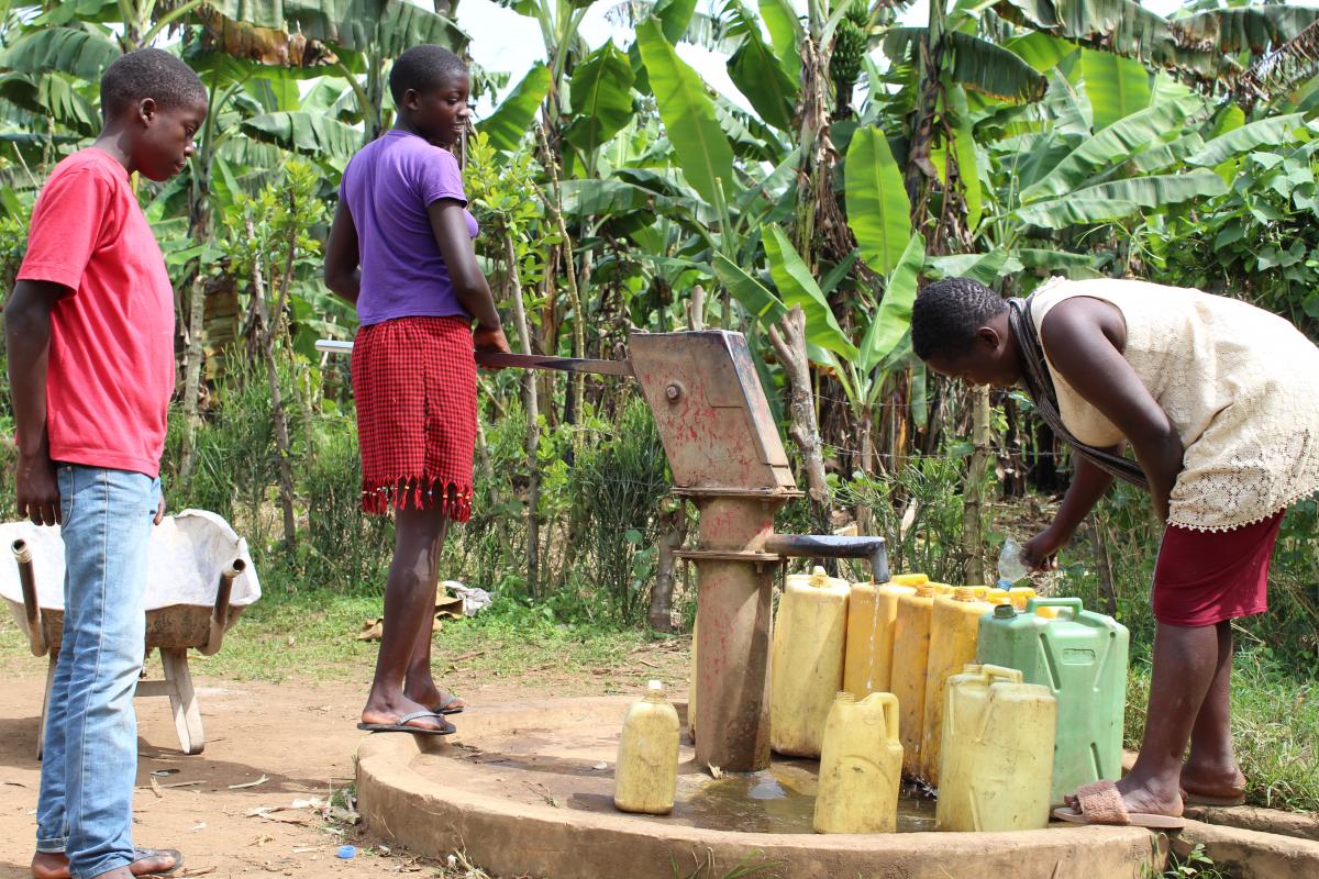 Siblings fetching water in Kabarole District Siblings fetching water in Kabarole District
