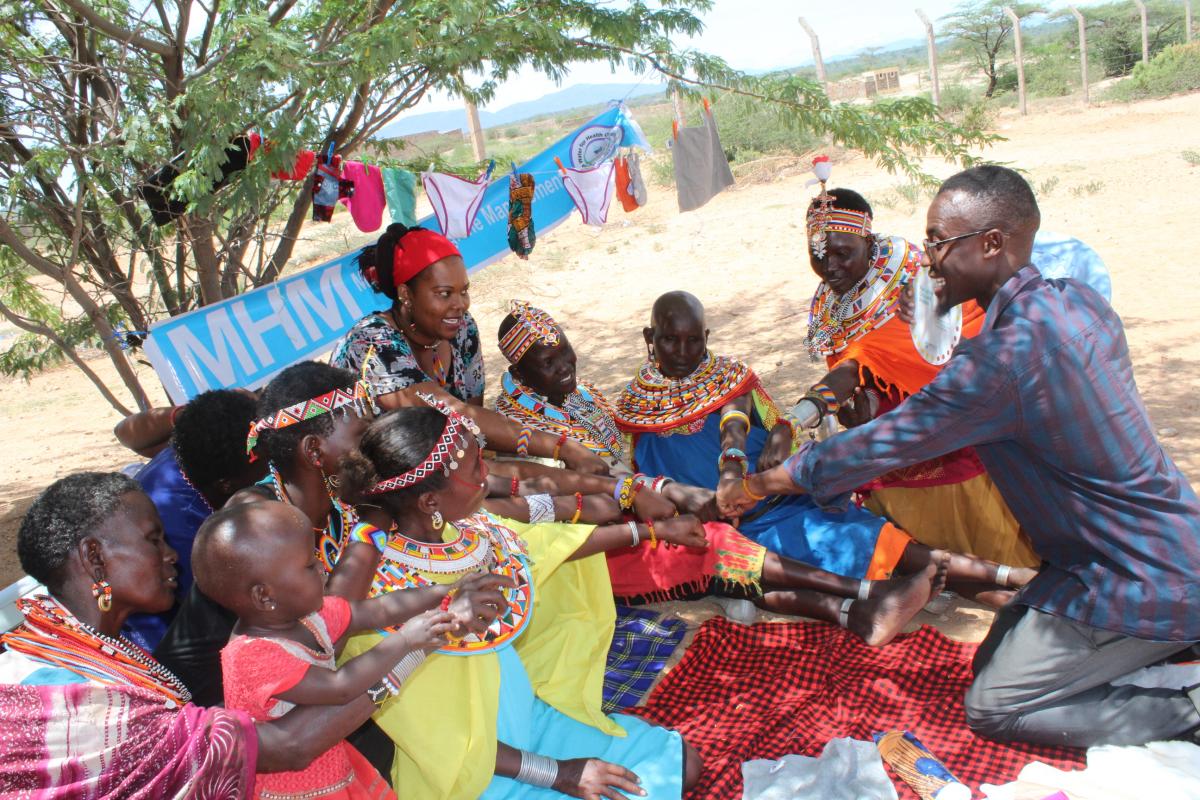 Samburu women taking the pledge to break the silence on menstruation in the MHM Lab. The MHM Lab is a safe space where women and girls support each other by freely sharing menstruation experiences