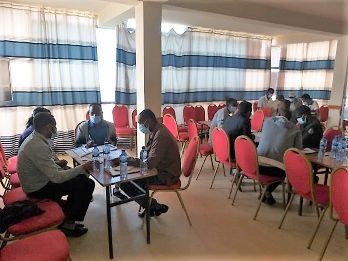 Participants around a table during group discussion