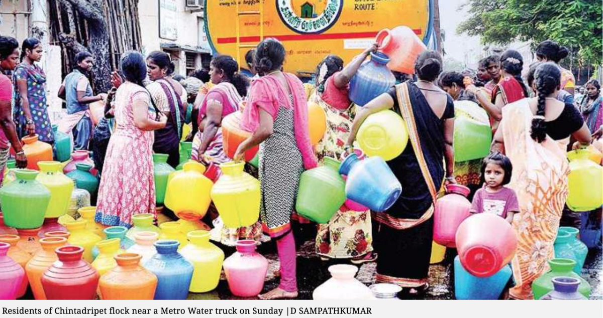 Residents of Chintadripet flock around a water truck (D. Sampathkumar) Residents of Chintadripet flock around a water truck (D. Sampathkumar)