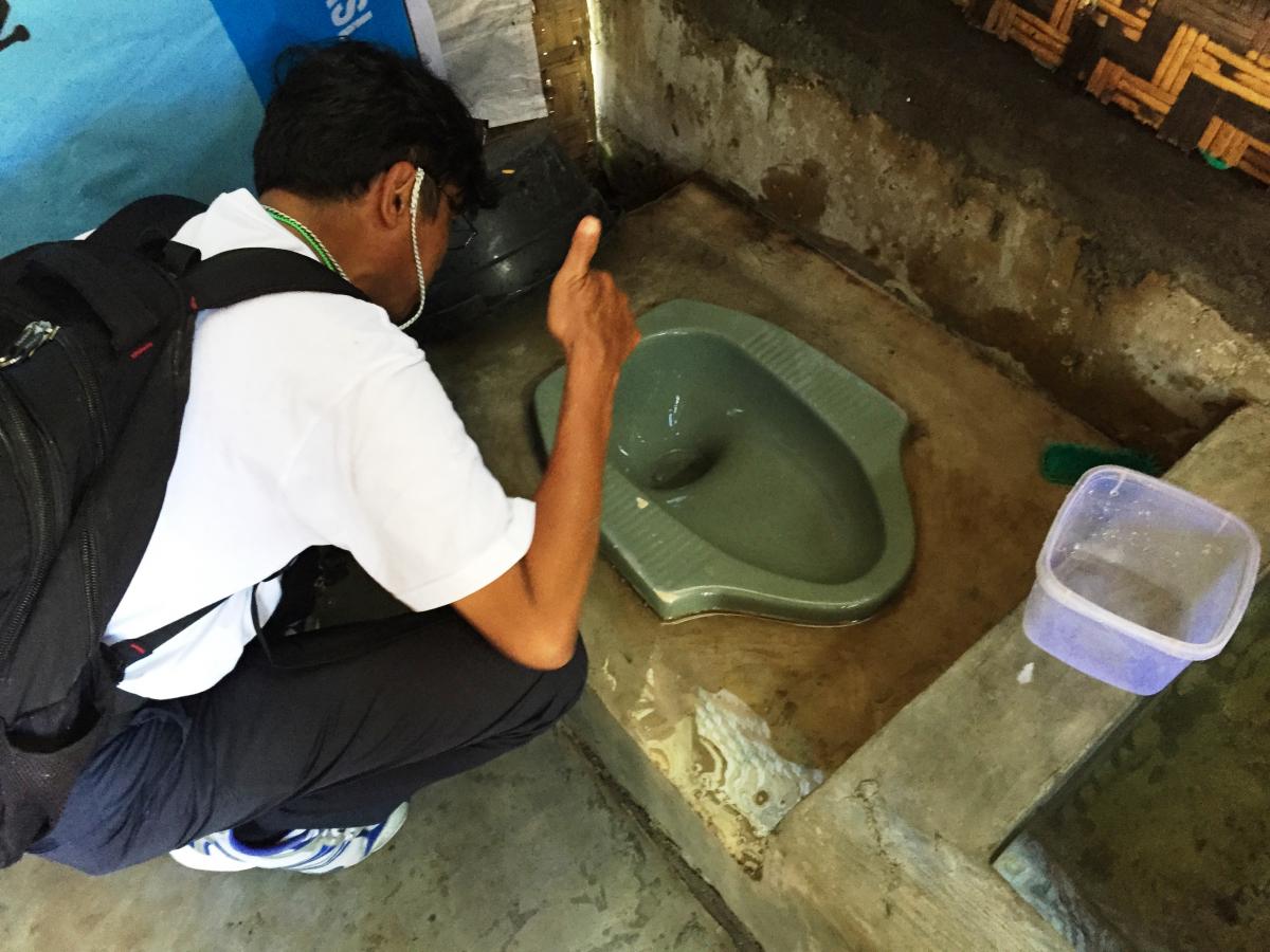 Taking a picture of a toilet in the SEHATI project Taking a picture of a toilet in the SEHATI project