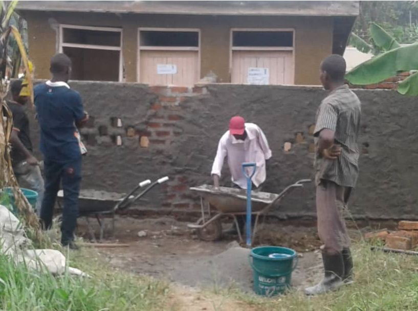 KAHASA working on curtain wall of latrines at a health centre (IRC Uganda) KAHASA working on curtain wall of latrines at a health centre (IRC Uganda)